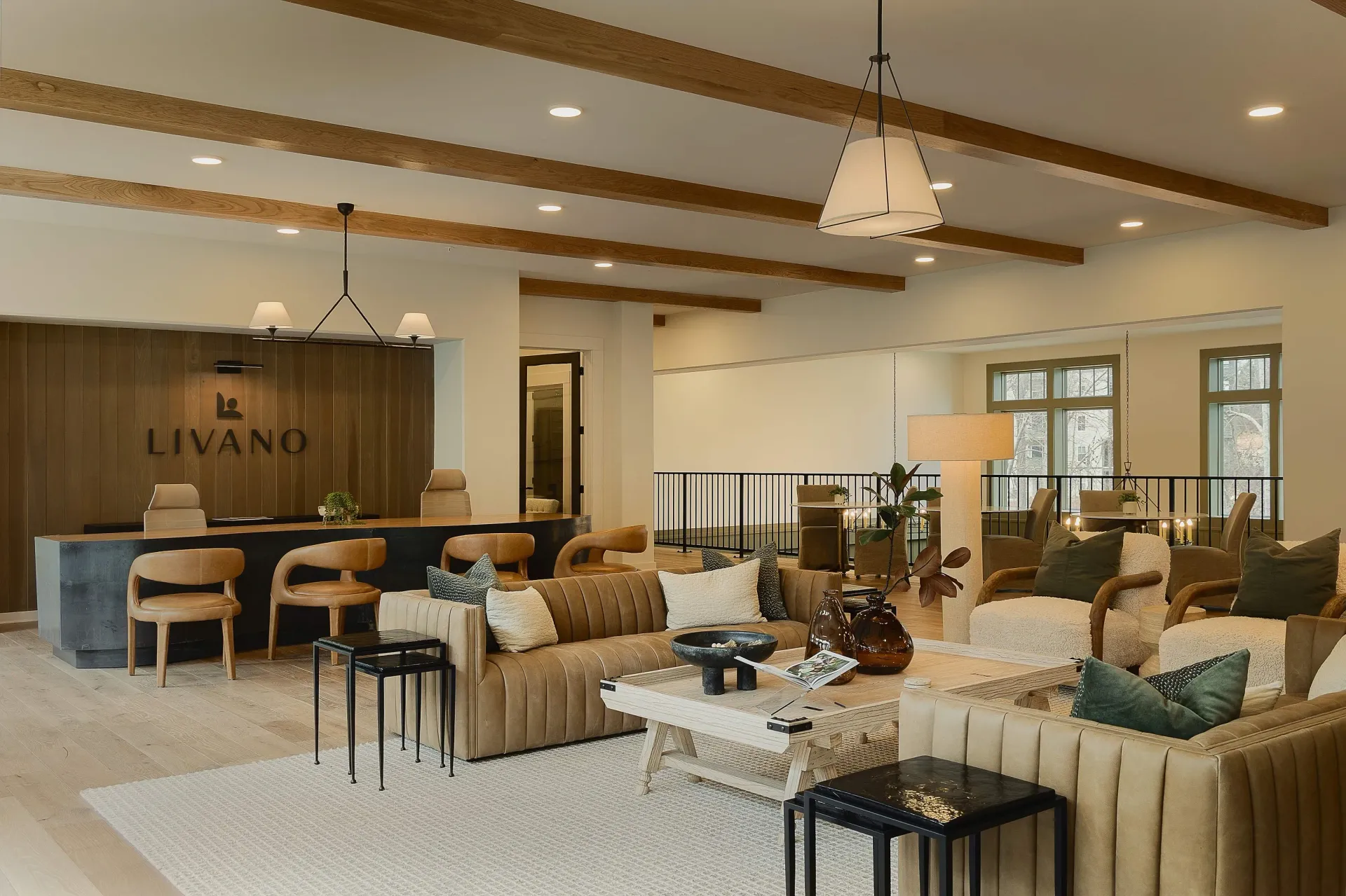 Modern reception desk with LIVANO logo and stylish seating area.