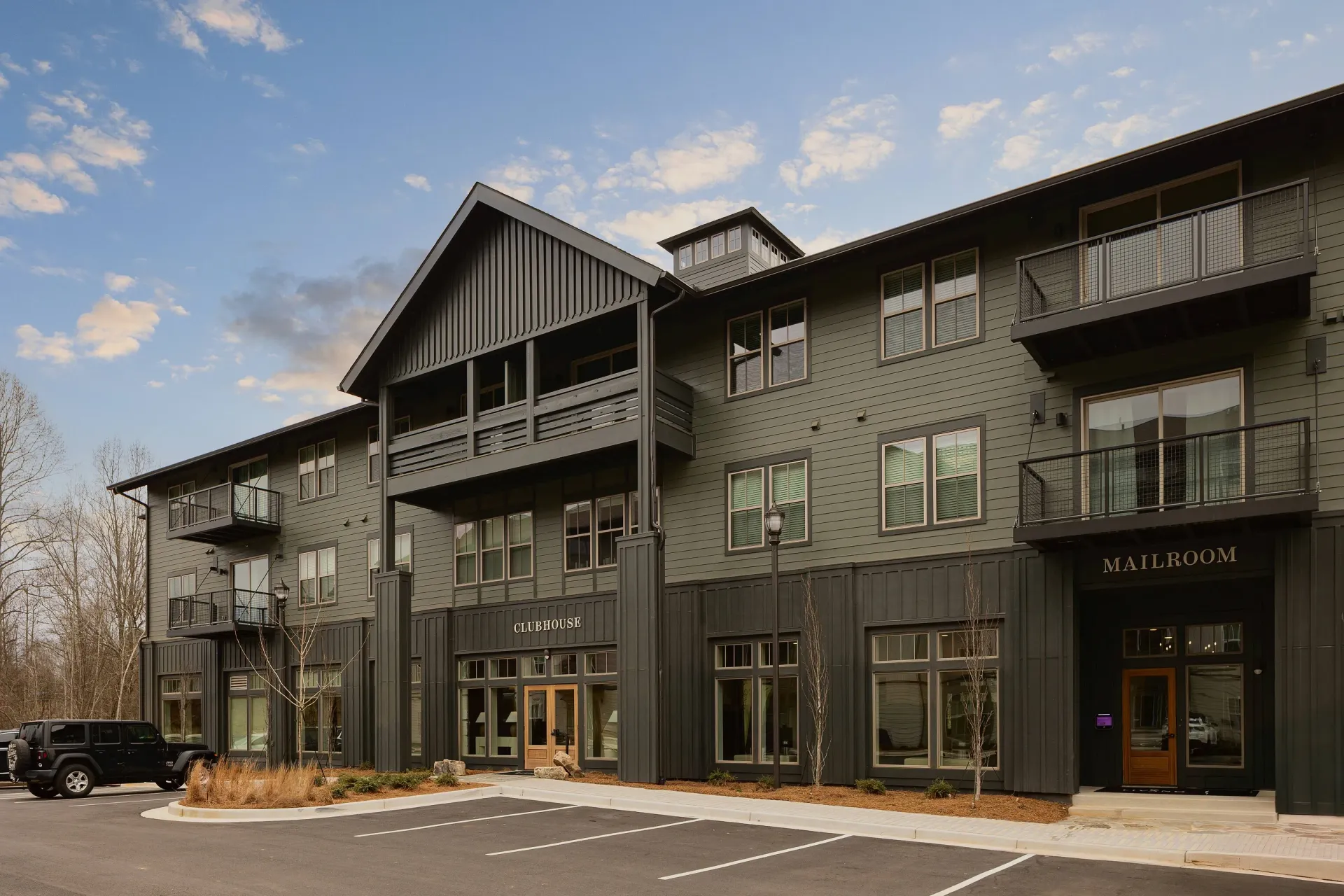 Exterior of apartment building with clubhouse and mailroom entrances