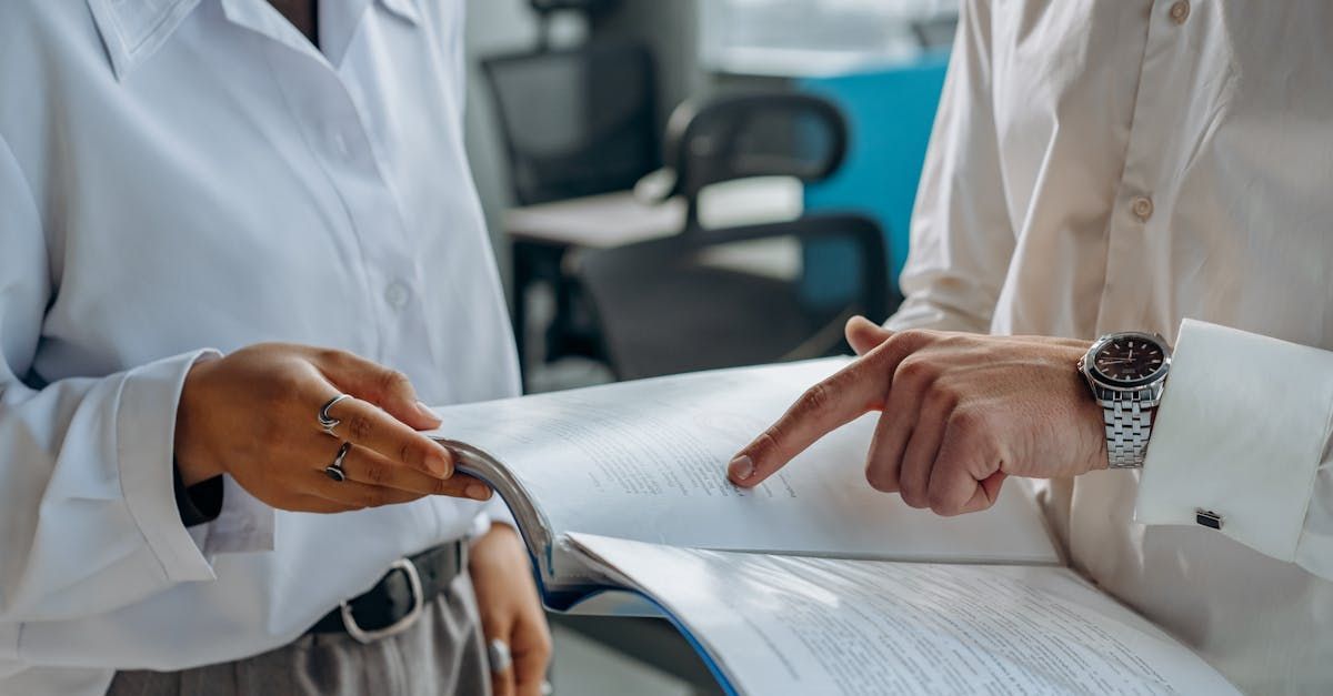 A man and a woman are looking at a piece of paper.