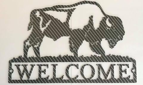 A black-and-white carbon fiber-patterned metal wall sign featuring a buffalo silhouette above the text 