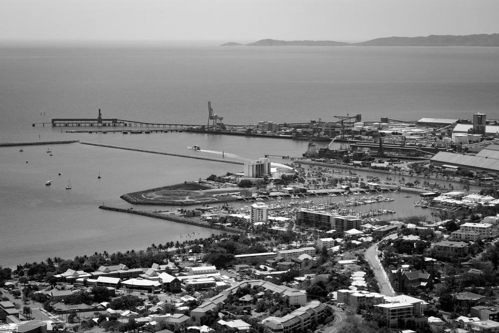 An Aerial View Of A City Next To The Ocean   — Lux Noir In  Townsville City, QLD