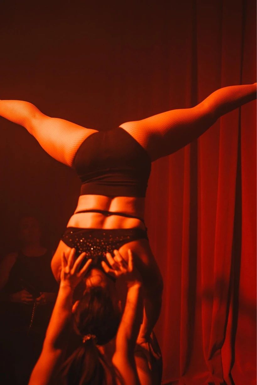 A Group Of People Are Dancing In A Dark Room With Candles — Lux Noir In  Mackay, QLD