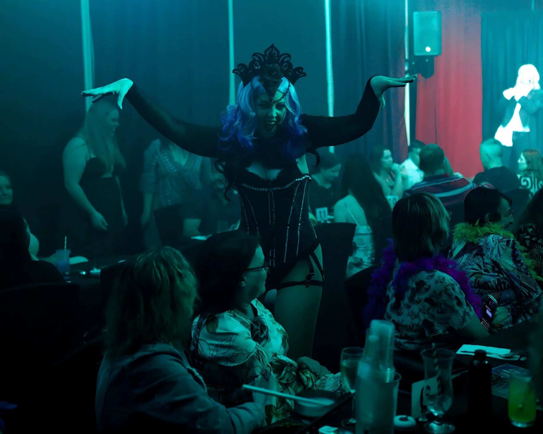 A Group Of Women Are Standing Next To Each Other In A Dark Room  — Lux Noir In Cairns, QLD