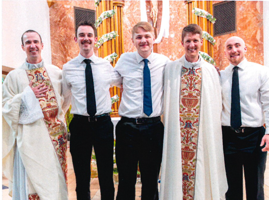 Pictured: Director of Vocations, Fr. Brian Hess (Newcastle) at the ordination of Fr. Lee Noel (Laramie). Pose with seminarians David Stotzer (Laramie), Anthony Richter (Gillette), and Henry Fritzler (Green River)