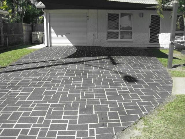 Black And White Photo Of A Driveway In Front Of A House — Diamond Concreting In Mount Low, QLD