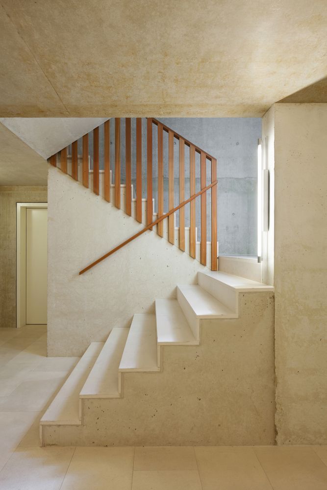 White Staircase With A Wooden Railing In A Room — Diamond Concreting In Mount Low, QLD