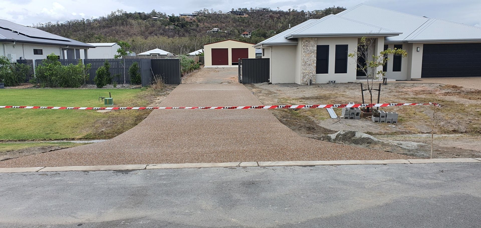 Cobblestone Road In A Park Surrounded By Trees And Grass — Diamond Concreting In Mount Low, QLD