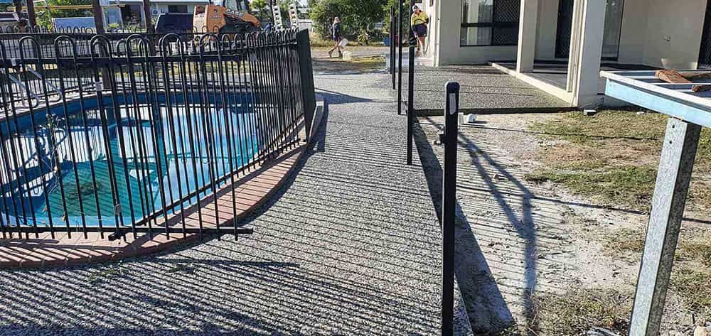 Fence With A Sign On It That Says Welcome — Diamond Concreting In Mount Low, QLD
