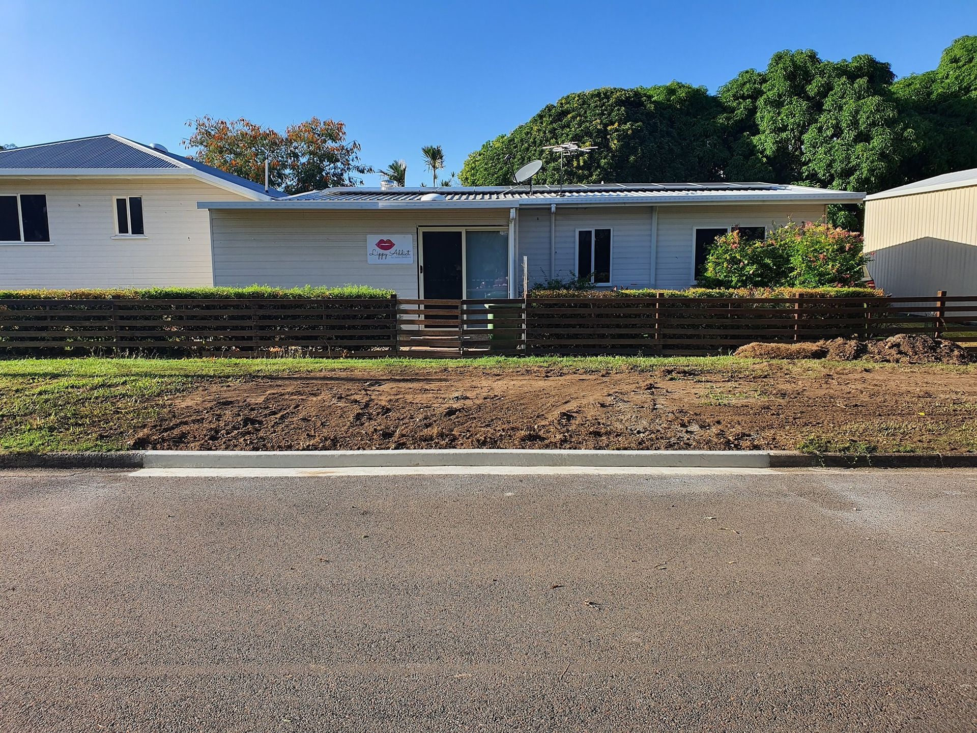 Close Up Of A Brick Walkway With A Leafy Hedge — Diamond Concreting In Mount Low, QLD