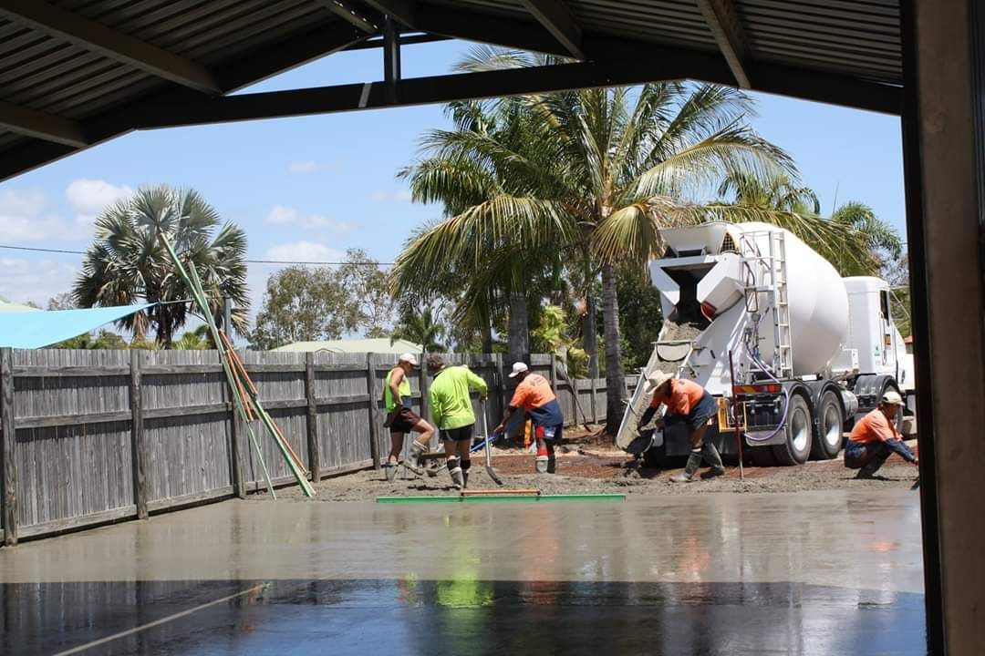 Group Of Construction Workers Working On A Concrete Floor — Diamond Concreting In Mount Low, QLD