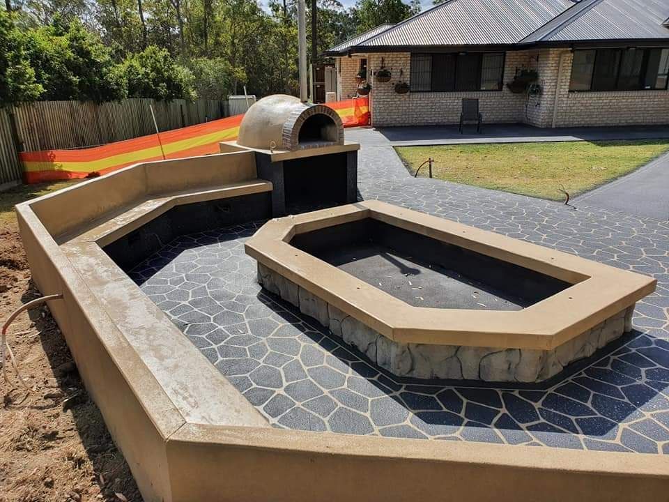 Brick Walkway With A Circular Pattern On It — Diamond Concreting In Mount Low, QLD
