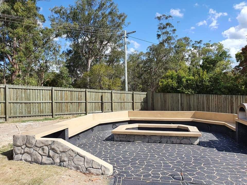Fire Pit In The Middle Of The Backyard — Diamond Concreting In Mount Low, QLD