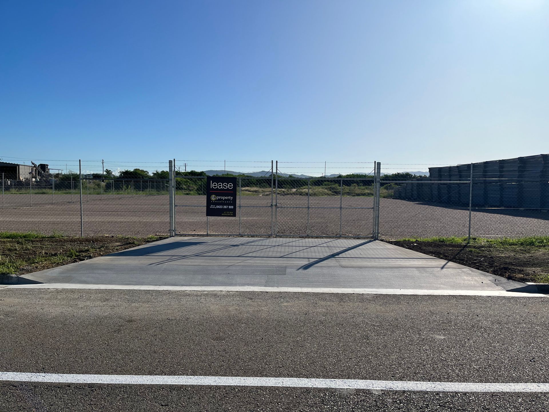 An Empty Parking Lot With Trees — Diamond Concreting In Mount Low, QLD