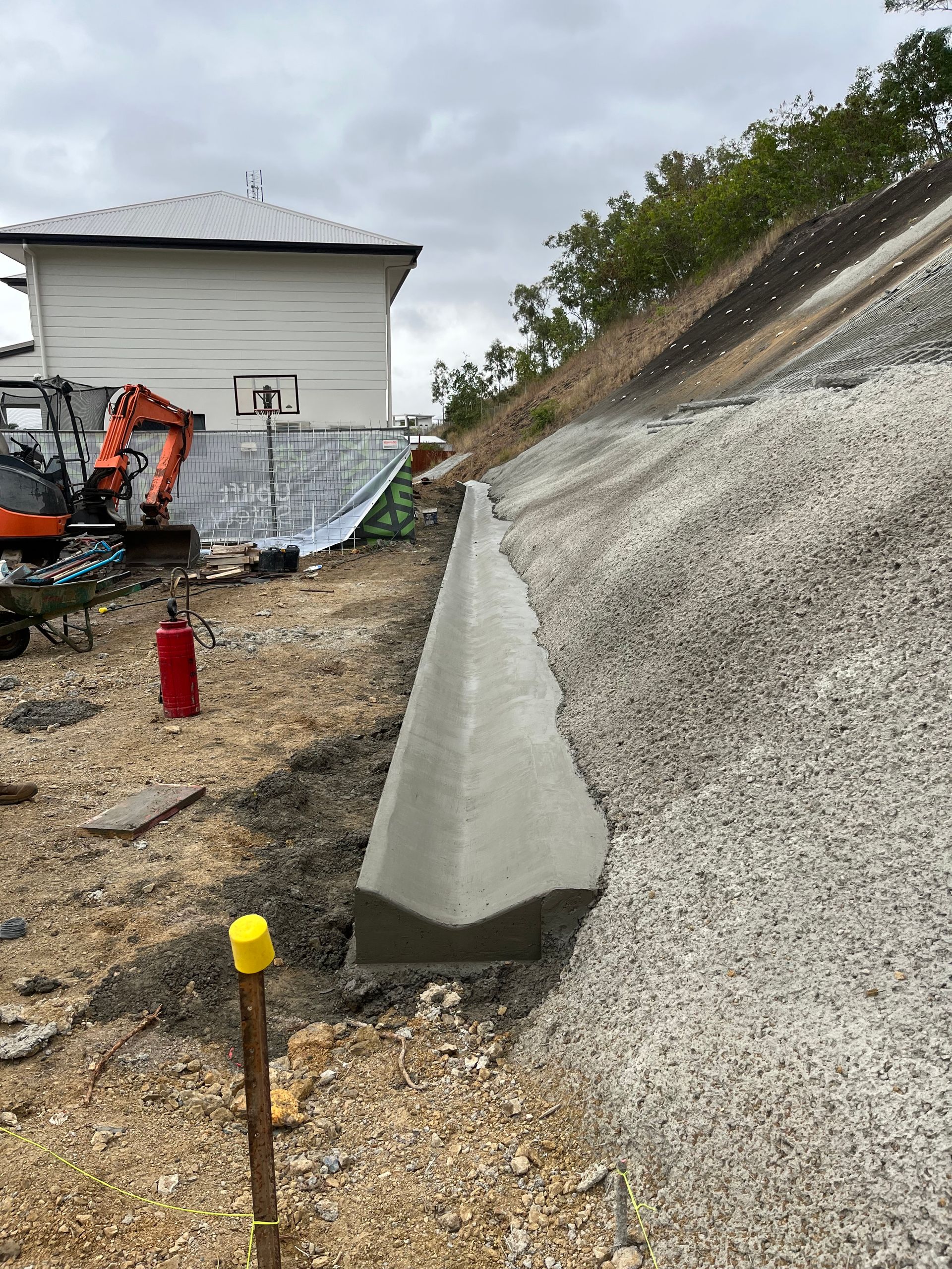 Close Up Of A Roof With Gravel On It — Diamond Concreting In Mount Low, QLD