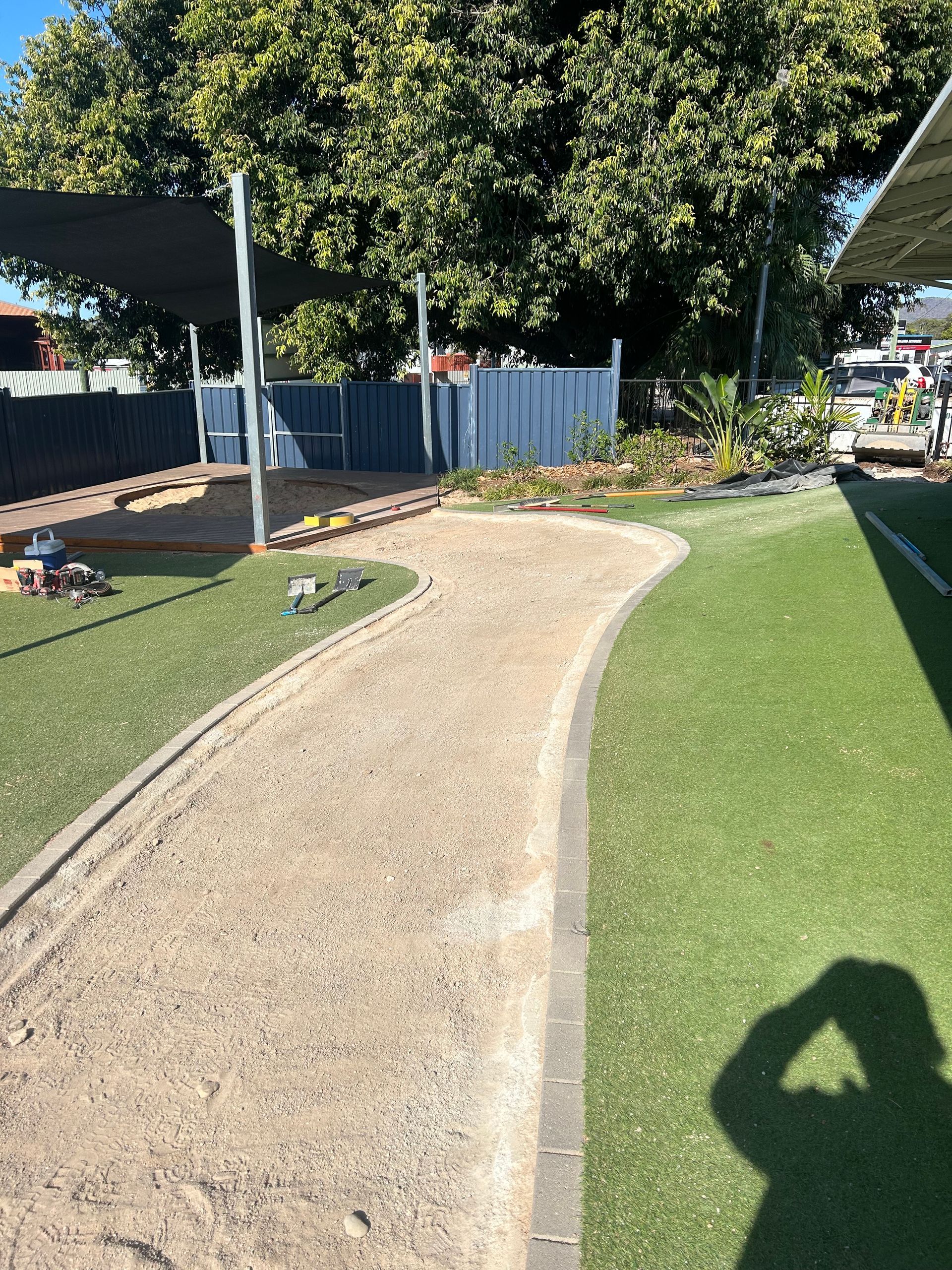 Concrete Walkway Surrounded By Bushes In A Park — Diamond Concreting In Mount Low, QLD