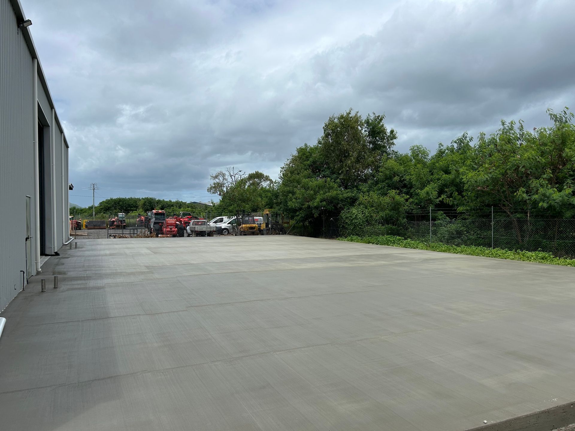Concrete Driveway Being Built In Front Of A House — Diamond Concreting In Mount Low, QLD