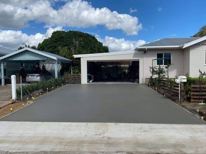 Concrete Driveway Built In Front Of A House — Diamond Concreting In Mount Low, QLD