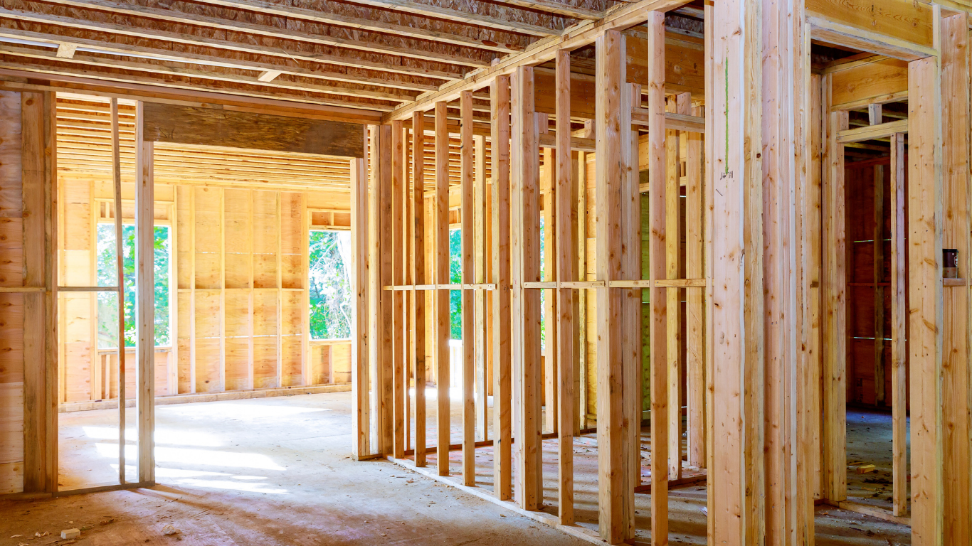 Interior wooden framing of a house under construction.