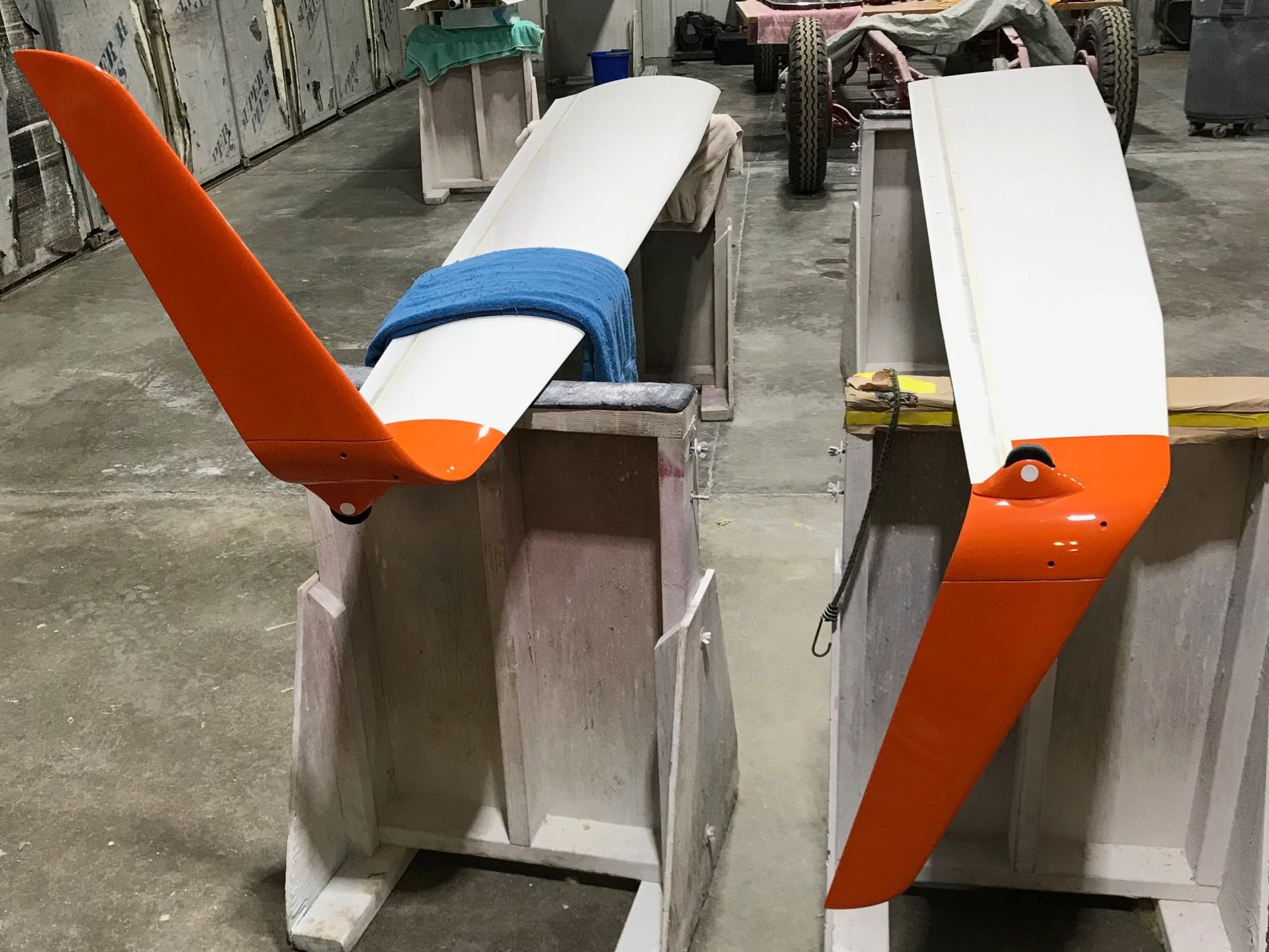 A pair of orange and white wings are sitting on a table