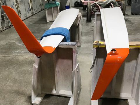 A pair of orange and white wings are sitting on a table