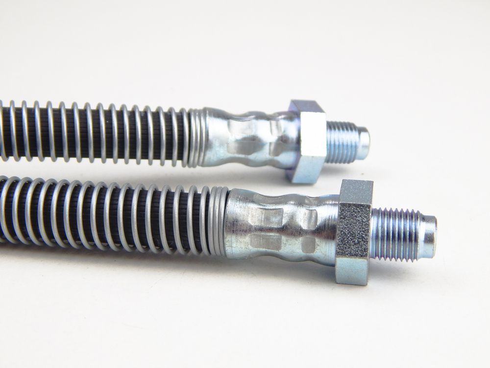 A Close Up of Two Brake Hoses on a White Surface — Beenleigh Bearings in Beenleigh, QLD