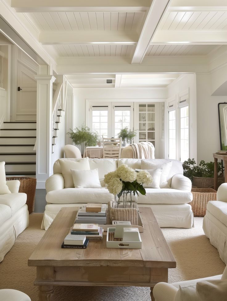 A living room with a dresser and a lot of paintings on the wall.