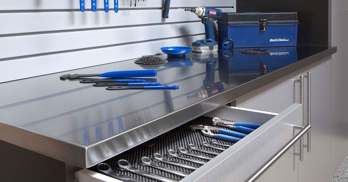 a stainless workbench filled with tools
