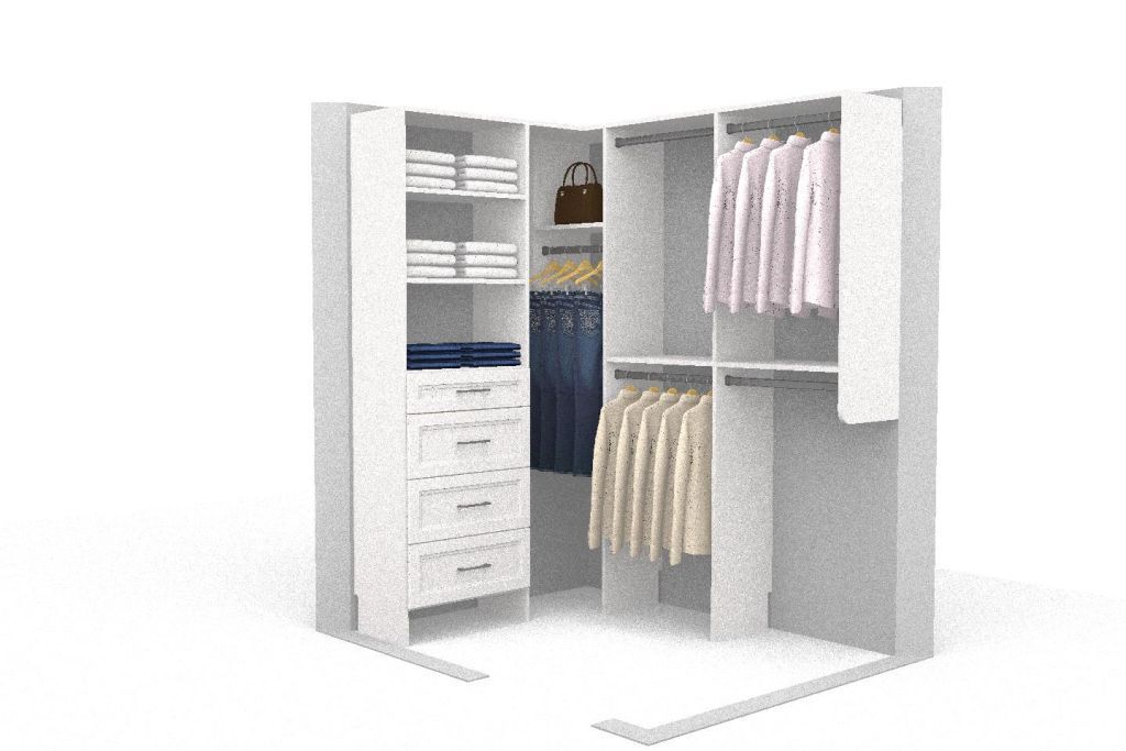A white closet with clothes hanging on the racks and shelves.