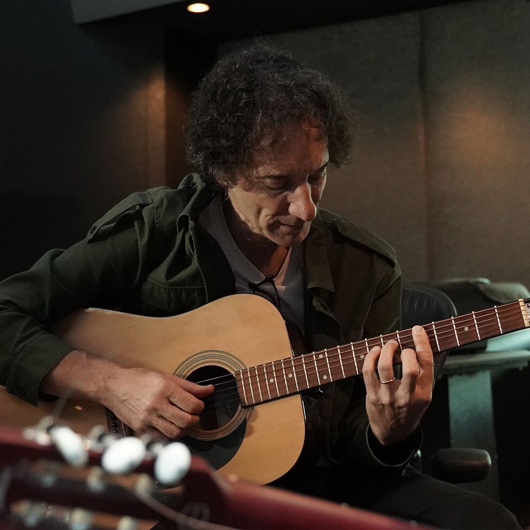 Guillermo Vadala playing acoustic guitar