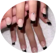 Hands with nude and black French manicure nails on a white textured background