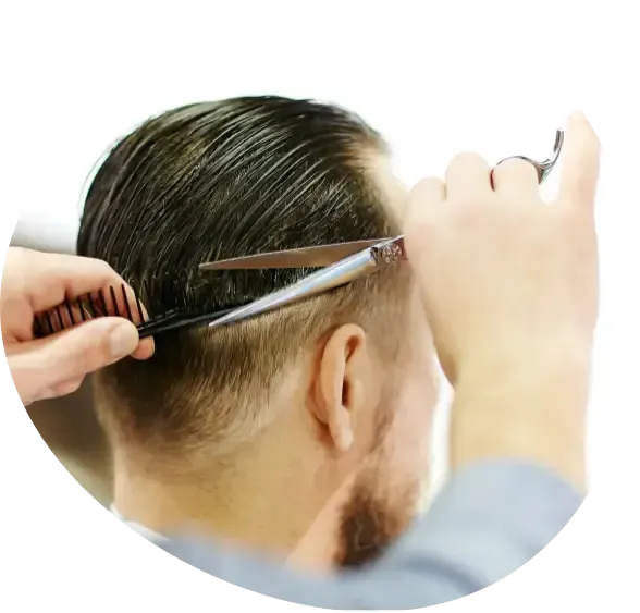 Person getting a haircut with scissors and comb, shaving the side of the head