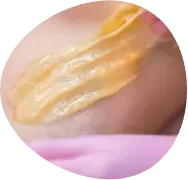 Close-up of a yellow translucent smear on skin with a pink edge below