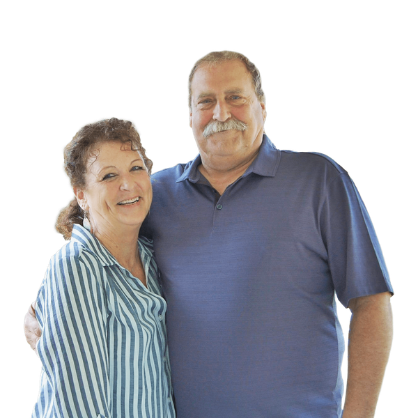 Pastor Ben Ridder and his wife, Karilynn are posing for a picture together.
