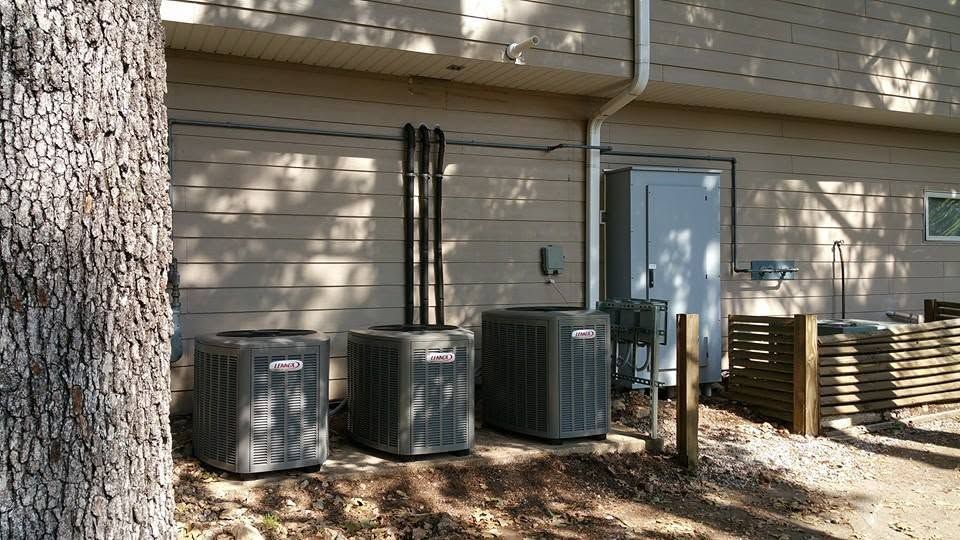 Outdoor HVAC units beside a house in Springfield MO