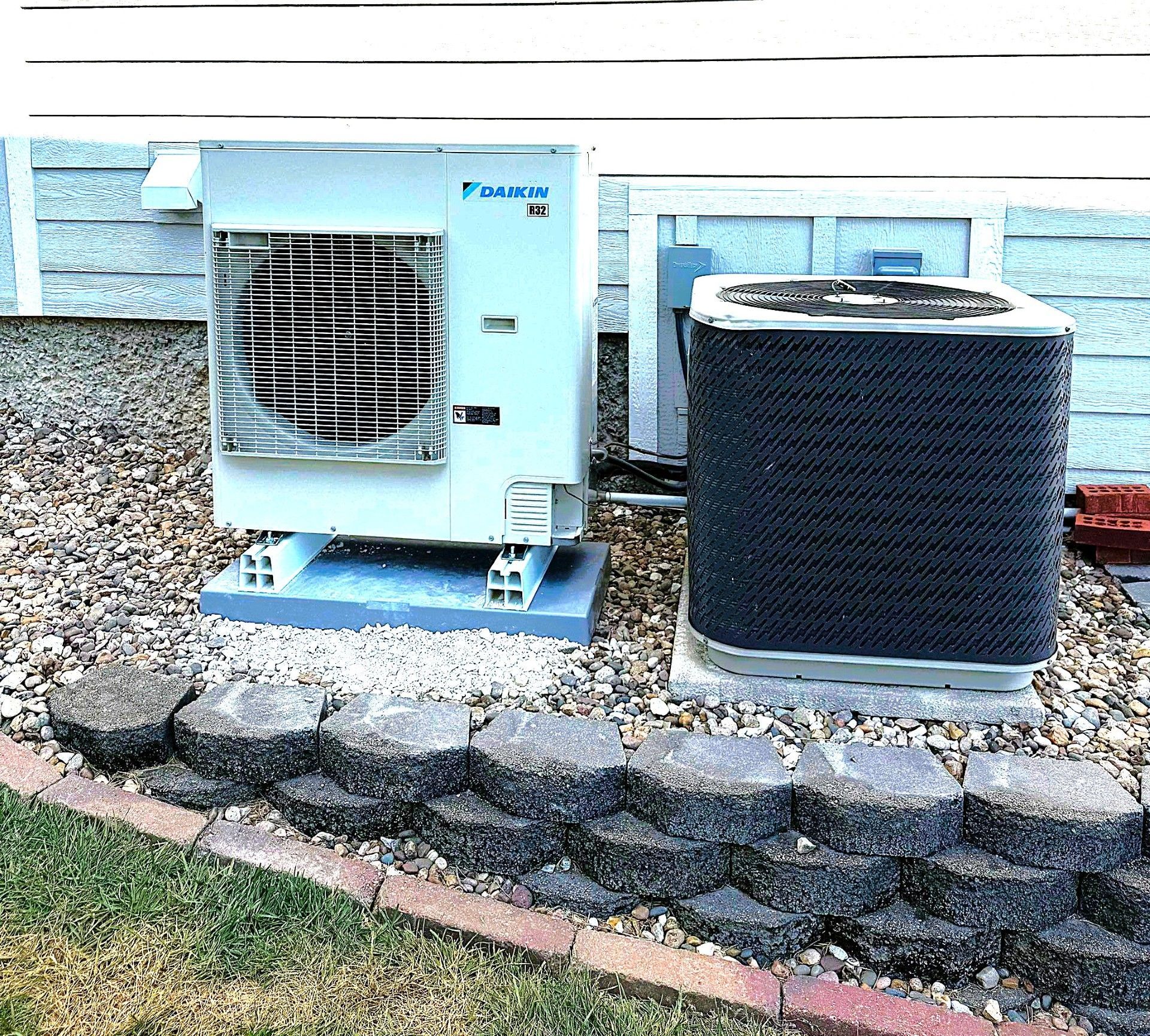 Outdoor air conditioning units beside a house in Springfield MO
