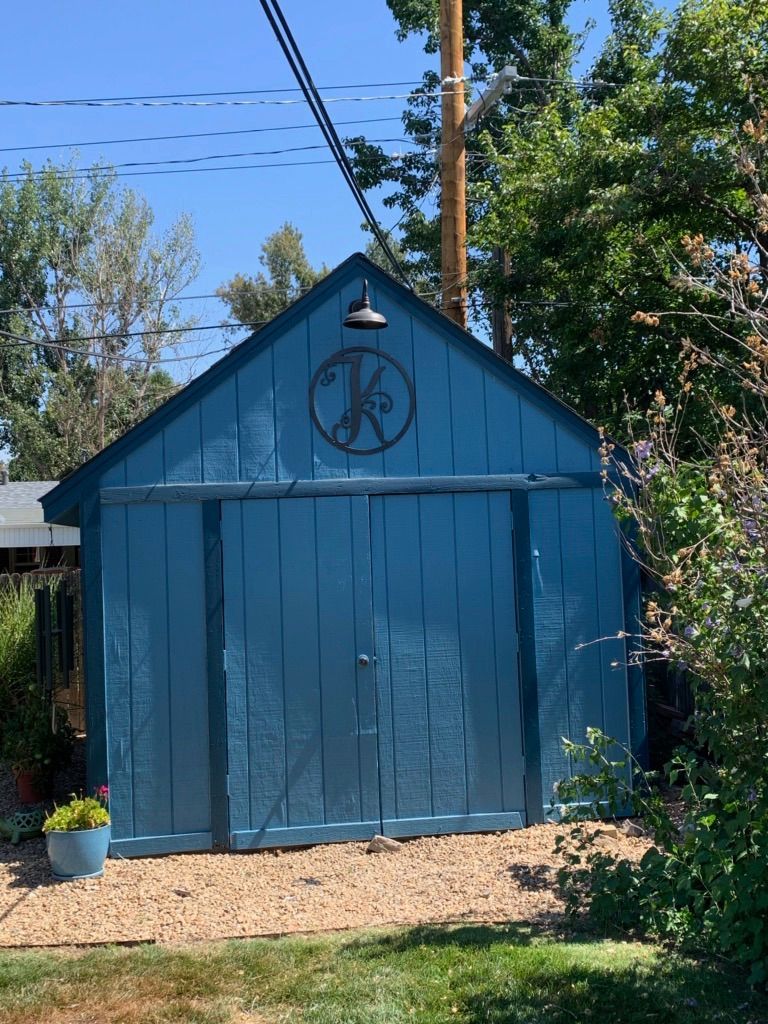 A blue garage with the letter k on it