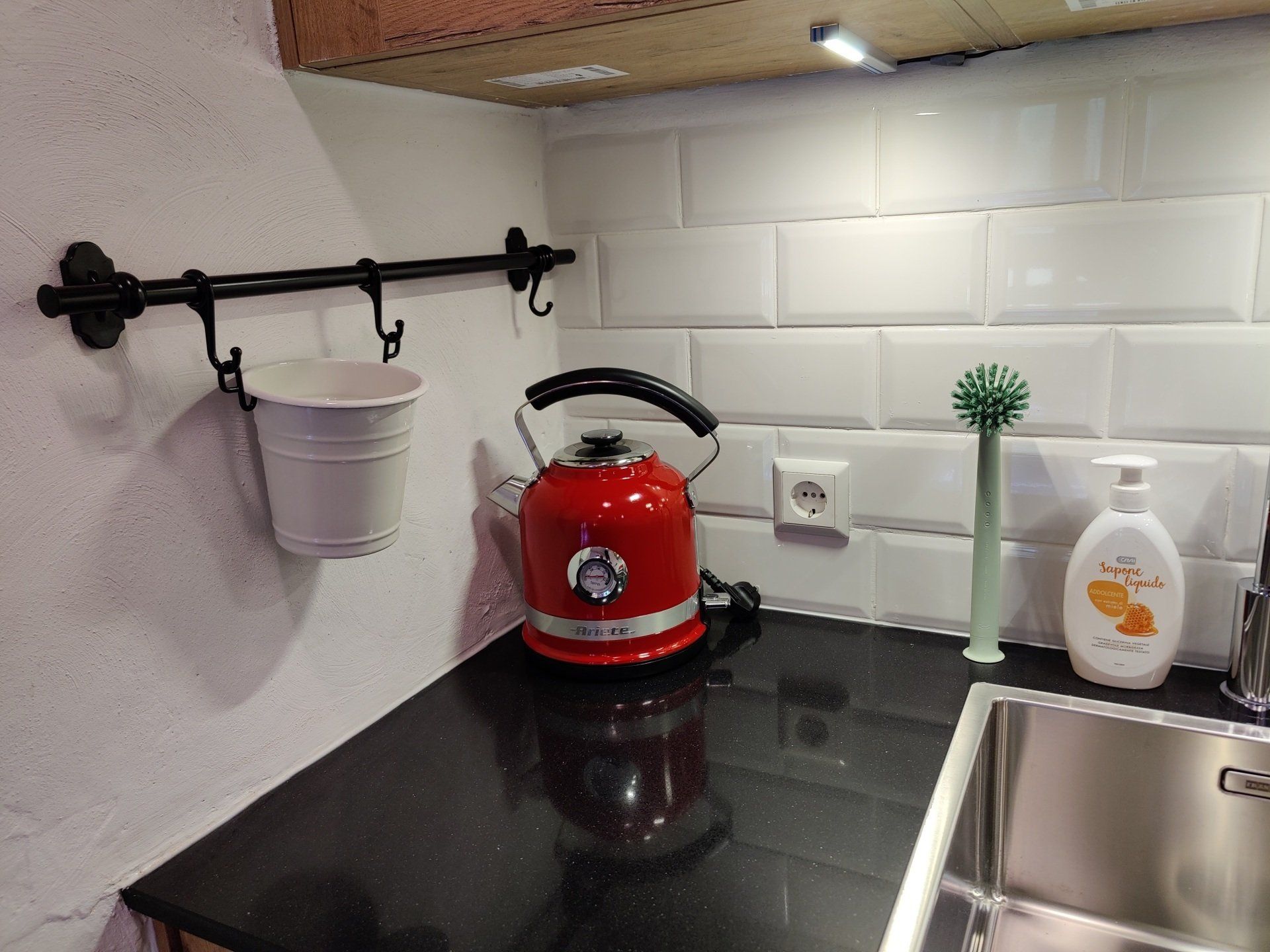 Kitchen with a kettle and soap