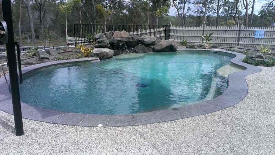 Pool With Rocks Design — Bundaberg, QLD — JJ's Pools & Spas