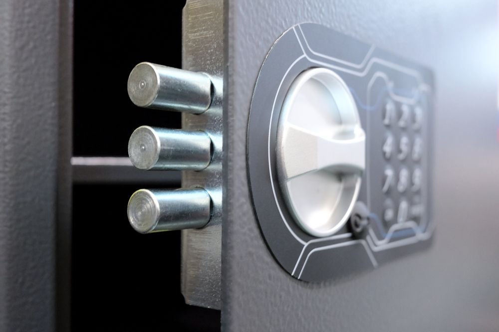 Close-Up of a Gray Safe Door With Three Silver Bolts, a Combination Dial, and a Keypad — North East Locksmiths in Wangaratta, VIC