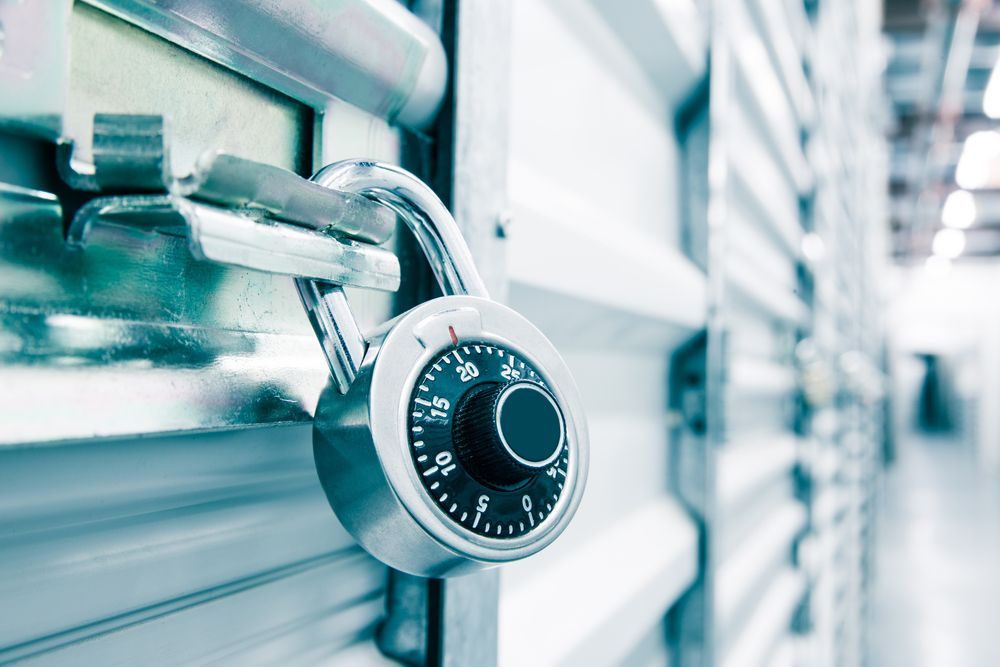 Silver Padlock on a Storage Unit Door, With a Blurred View of Other Units in the Background — North East Locksmiths in Wodonga, VIC