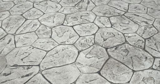 Cracked gray concrete surface with irregular stone-like pattern