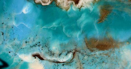 Turquoise water with sandy brown swirls and dark streaks, resembling an abstract aerial landscape.
