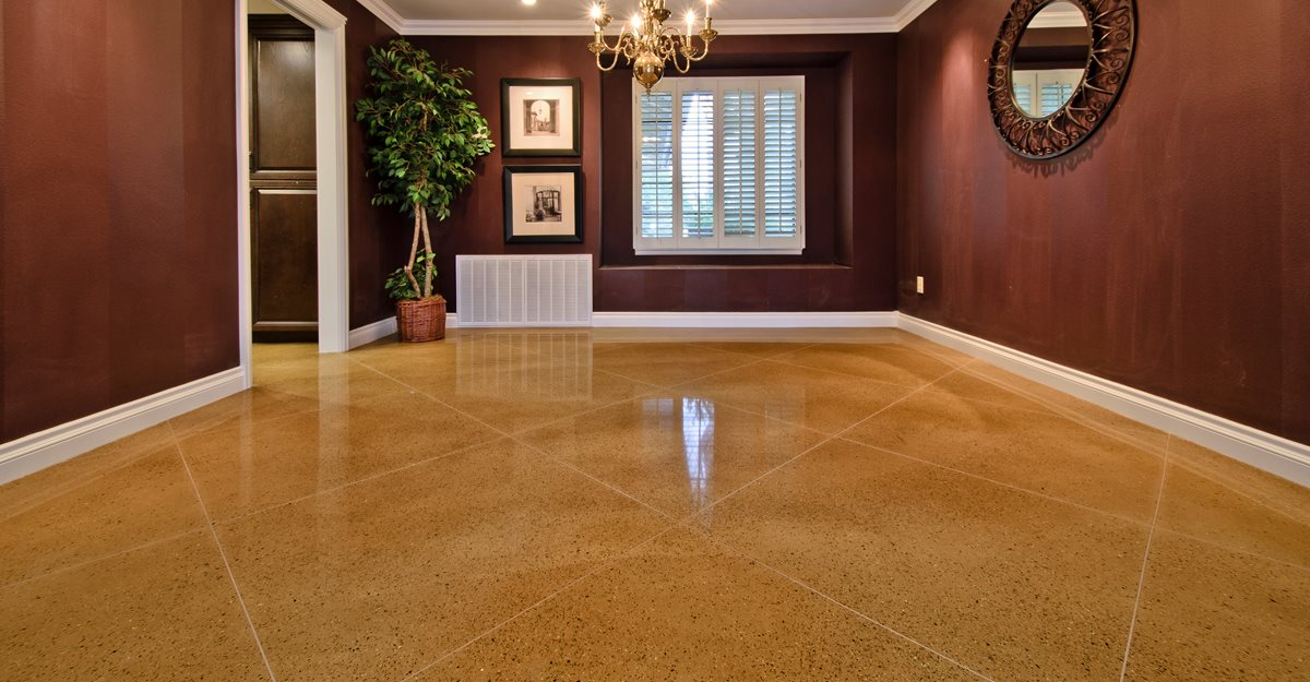 Empty polished hallway with brown walls, glossy floor, and windows at the far end