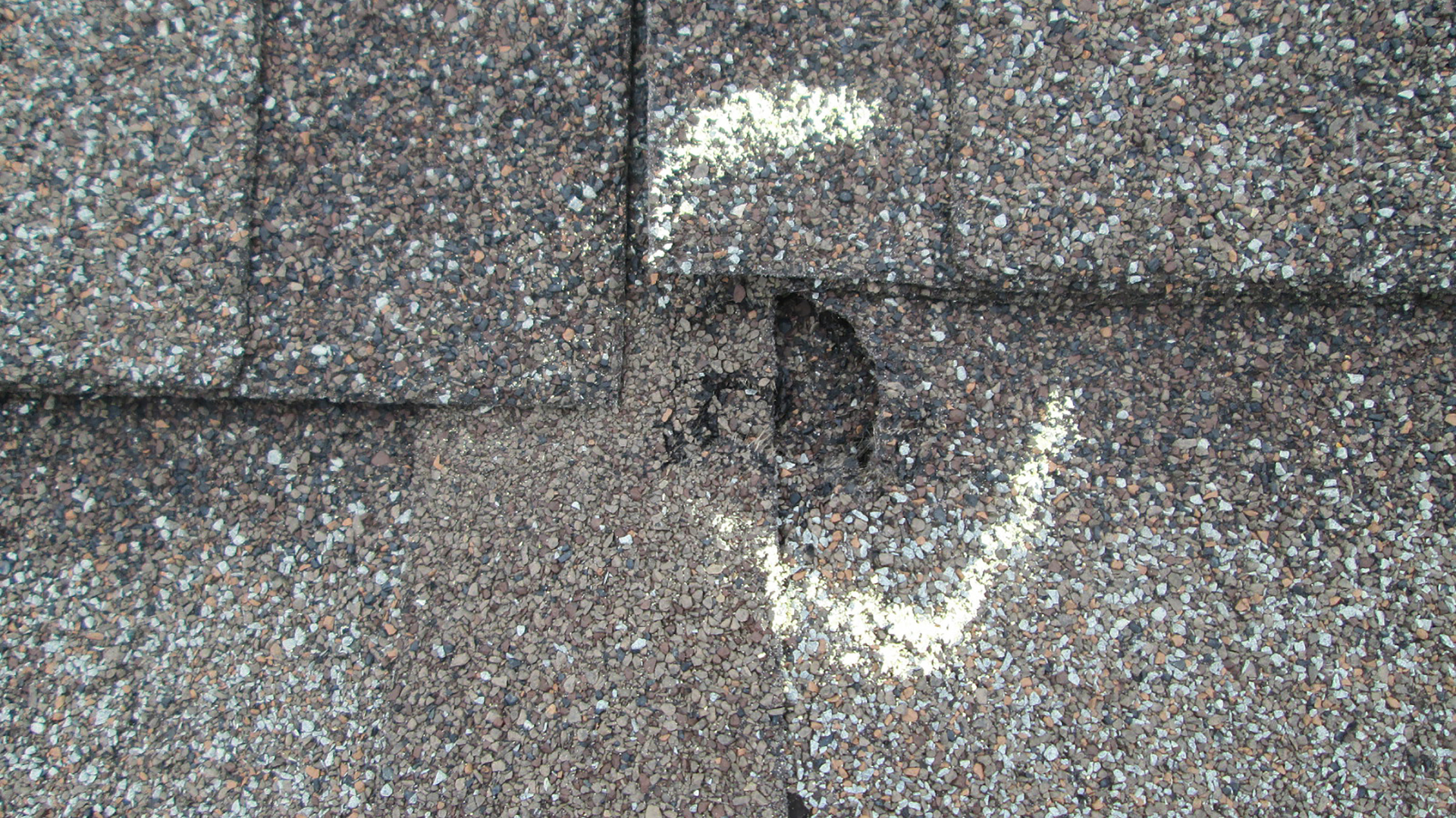 A close up of a roof with a hole in it.