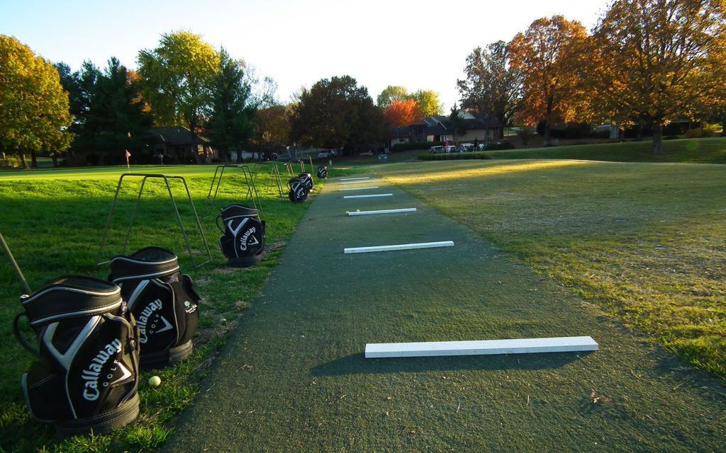A row of golf bags with the word callaway on them