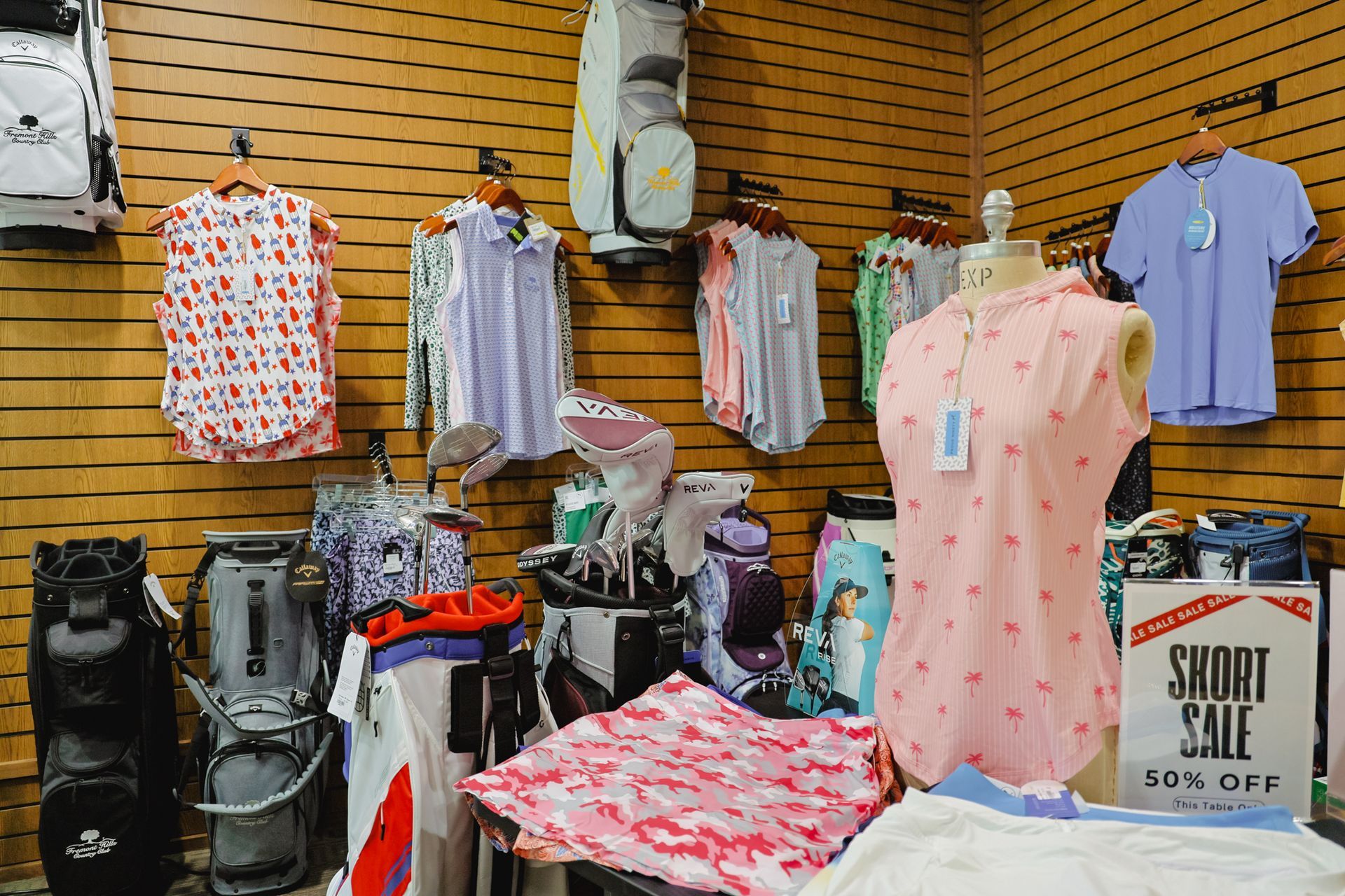 A store filled with clothes and a sign that says smoke sale