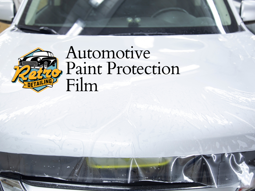 Car hood wrapped in clear paint protection film with Retro Auto Detailing logo and “Automotive Paint Protection Film” text