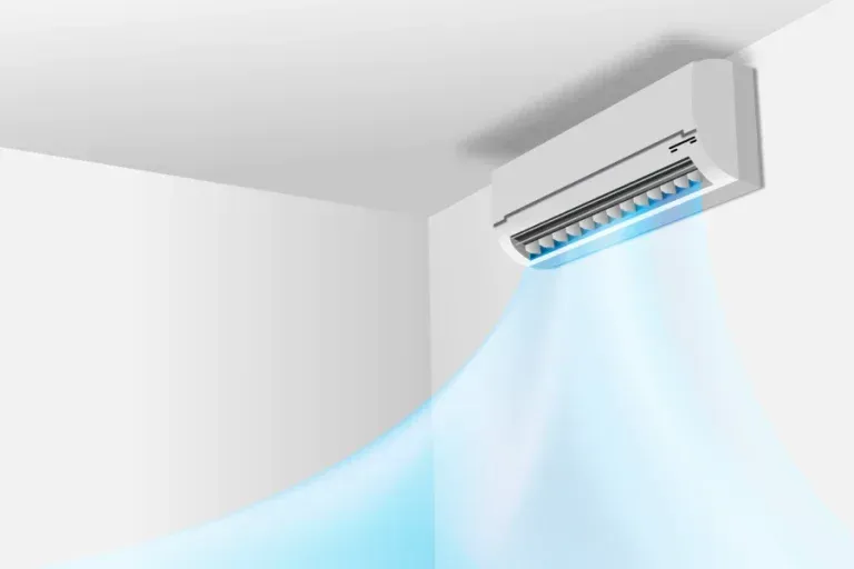 A white wall-mounted air conditioner unit blowing a cool blue stream of air into a room.