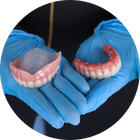 Dentures & Dental Implants | Alexandria VA Dentist Holding Teeth | Dentures and Dental Implants | Alexandria VA