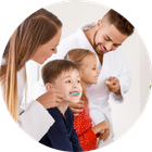 Pediatric and Adult Dentistry | Alexandria VA Adults Helping Children Brush Teeth | Pediatric Dentist | Alexandria VA
